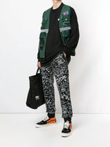 MARCELO BURLON C OF MILAN HOME scribble print track pants