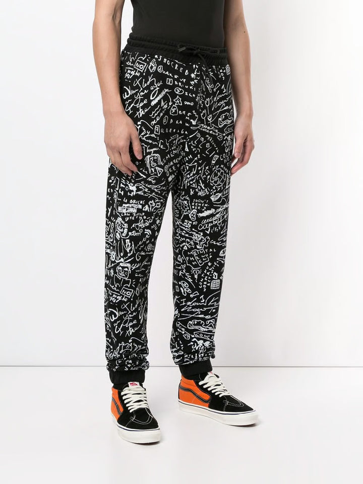 MARCELO BURLON C OF MILAN HOME scribble print track pants